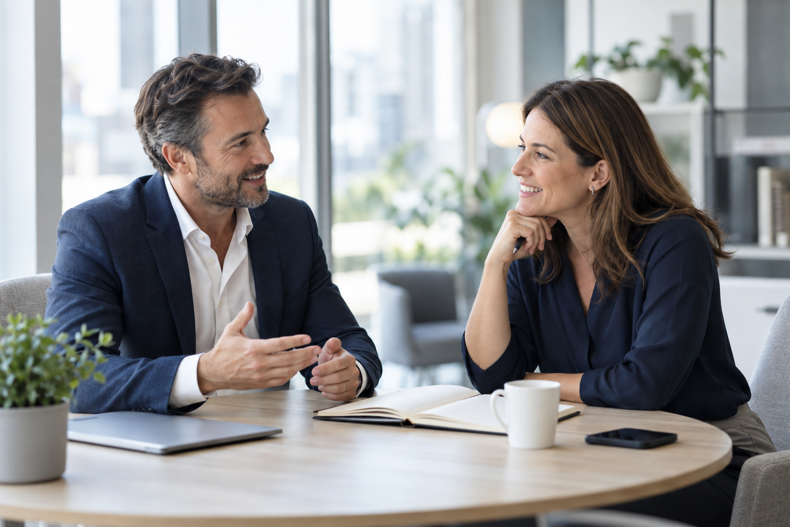 Illustrative image of two smiling business professionals discussing a plan